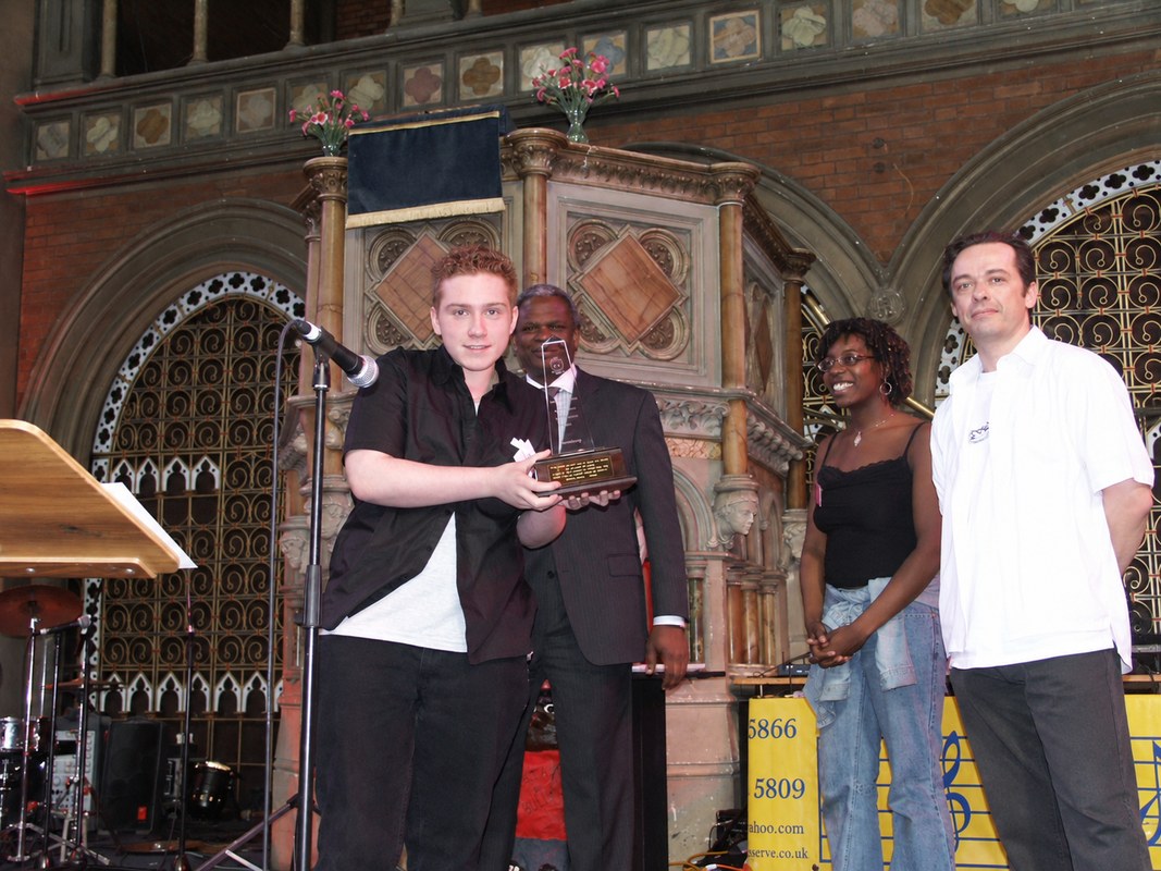 A young person receiving an award at an iPowerI anti-bullying event